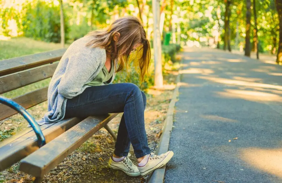 Woman having menstruation cramp. Painful Periods and Naturopathy. Brisbane Livewell Clinic