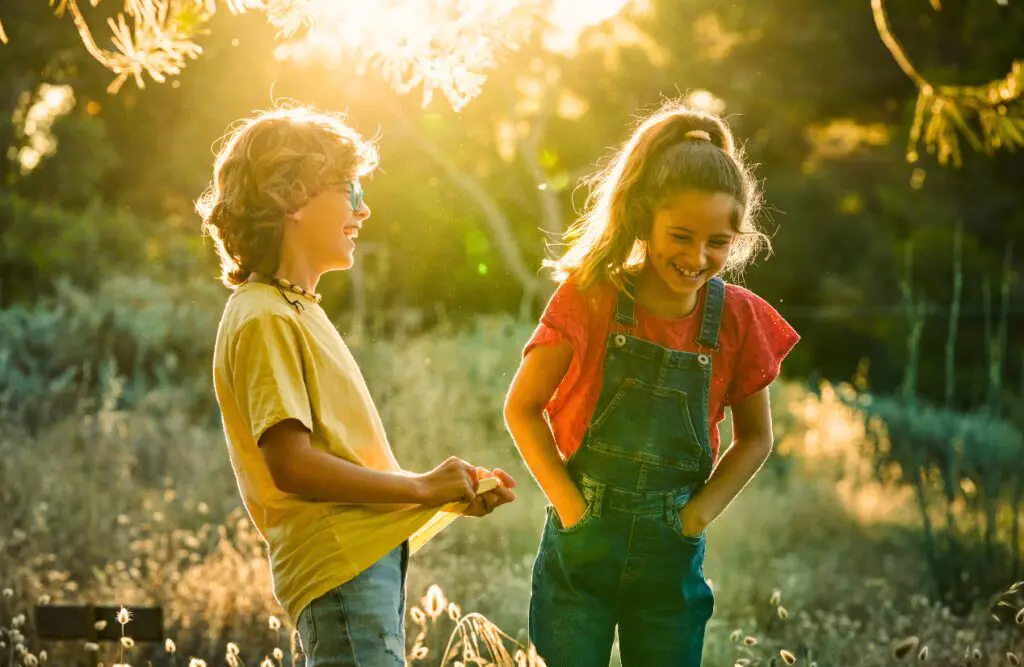Boy and girl laughing together in nature. Heavy Metal Toxicity in Toddlers. Brisbane Livewell Clinic
