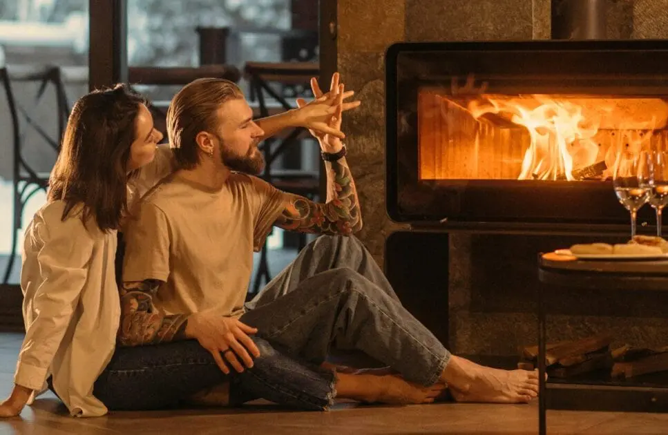 Couple enjoying a warm moment together in front of a fireplac. Marriage Counselling. Brisbane Livewell Clinic