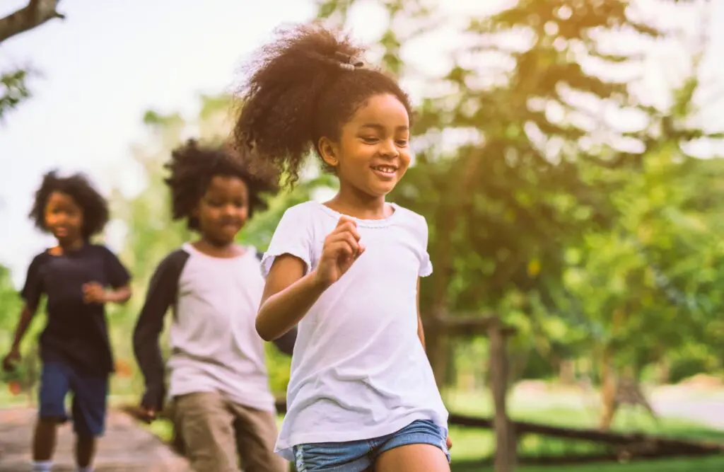 Kids running around the park. Can Osteopathy help Children and Teenagers. Naturopath for Children. Brisbane Livewell Clinic