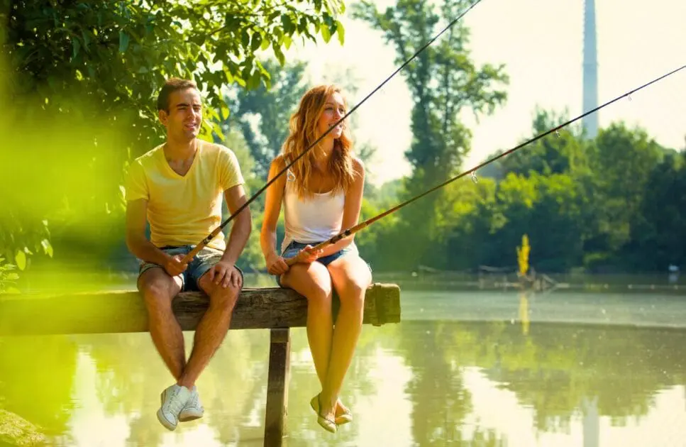 Couple having fun fishing together on a lake. Relationship Counselling Brisbane. Relationship Counseling Near Me. Brisbane Livewell Clinic