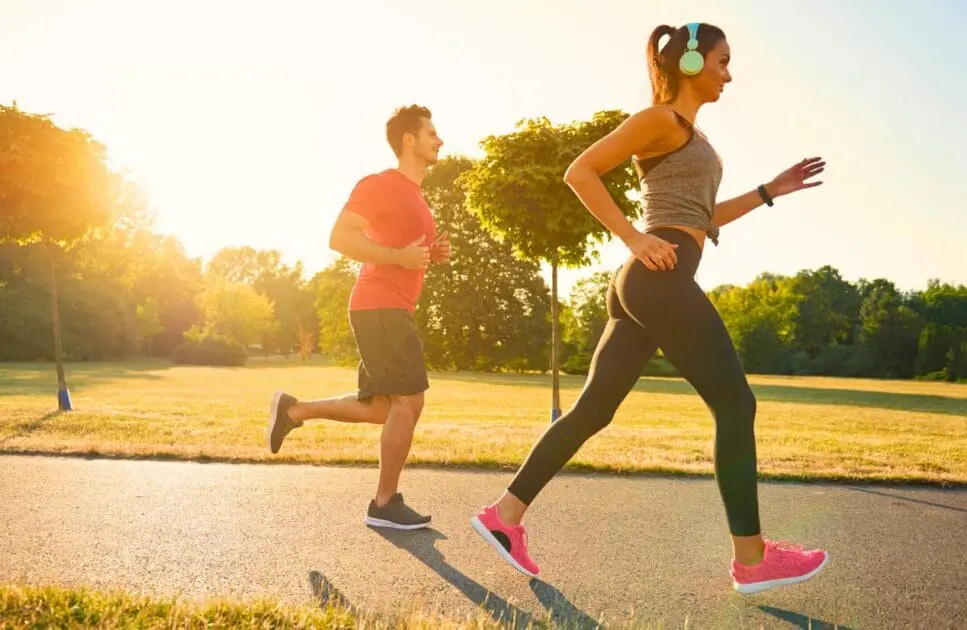 Man and woman jogging in the park. Couples Therapy Counselling. Osteopath for Foot Pain and Plantar Fasciitis. Brisbane Livewell Clinic