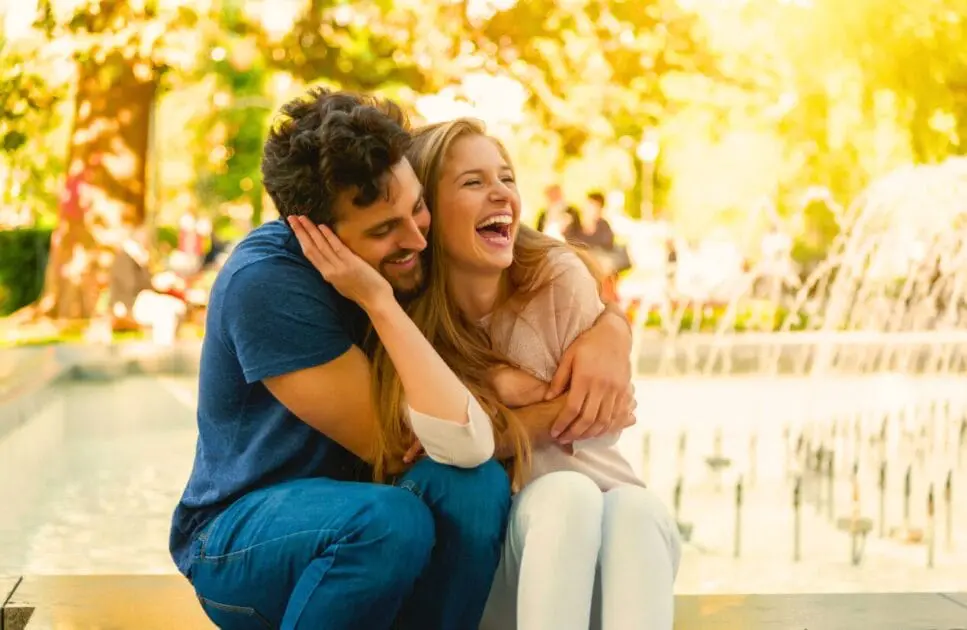 Happy couple sitting on the park. Counselling the Bereaved. What does an Osteopath do. Brisbane Livewell Clinic