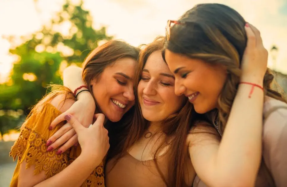 Tree women smiling and hugging each other. Trauma Counselling. Neuralgia. Holistic Counselling for Emotional Burnout. Holistic Counselling for Common Concerns in Brisbane. Counselling Kalinga. Brisbane Livewell Clinic