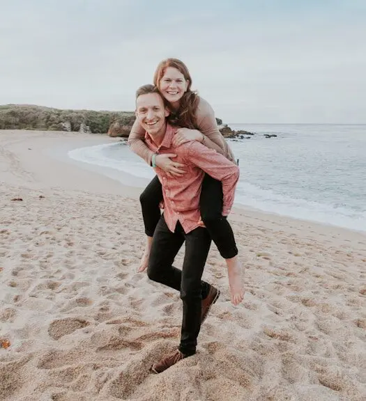 Man carrying woman on the beach. Brisbane Counselling Centre in Brisbane, QLD