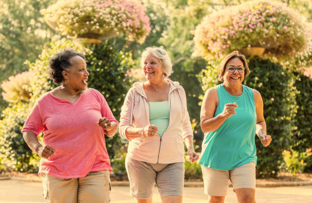 Happy women doing walk exercise at the park. Managing Menopause. Brisbane Livewell Clinic