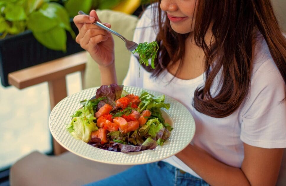 Woman eating healthy salad. Mothers Day. Brisbane Livewell Clinic