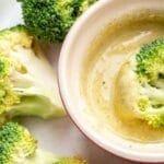 A bowl of a creamy soup. Broccoli & Spiced Yoghurt