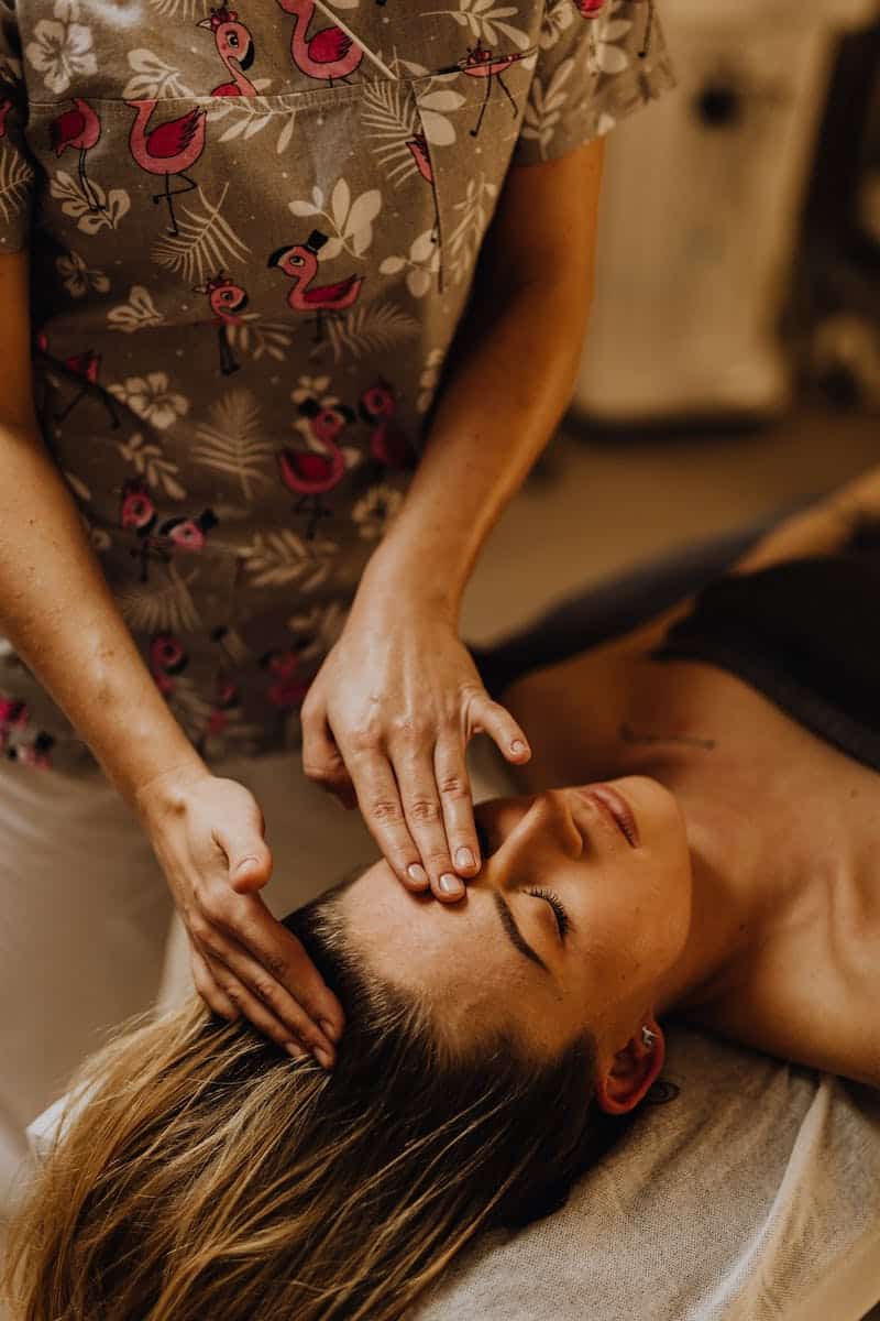 A Massage Therapist Giving a Head Massage. Brisbane Livewell Clinic.