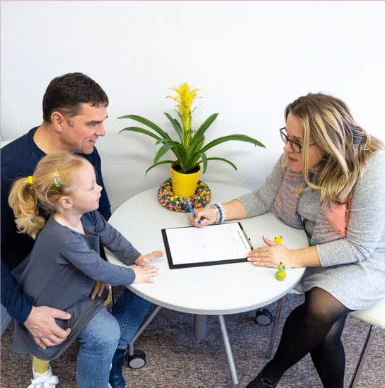 Naturopath consulting with man and child. What is a Naturopath - Brisbane Livewell Clinic. Naturopathic
