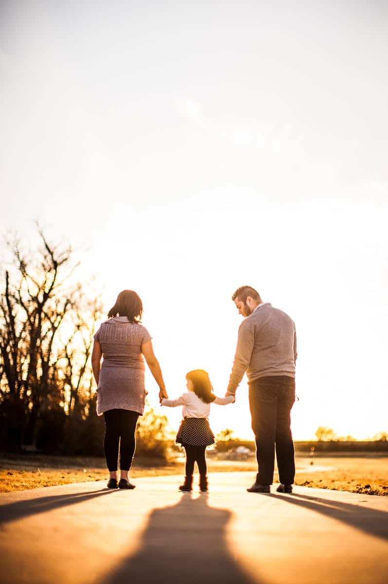 Photo of Family Standing Outdoors During Golden Hour. No longer drinking alcohol