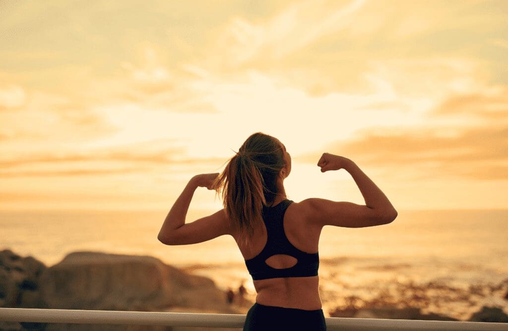 Woman flexing her body. Binge eating. What does an Osteopath do. How Osteopathy may Support Injury Recovery and Mobility. Brisbane Livewell Clinic