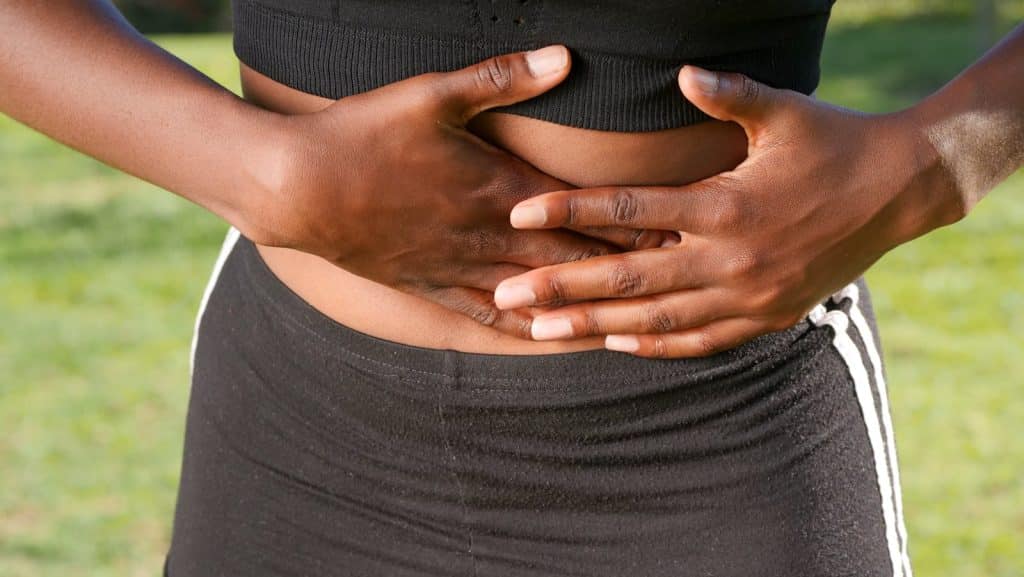 Person having Stomach Pain. Digestive Problems that cause weight gain