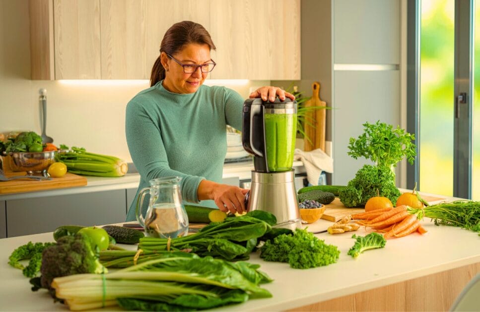 Woman preparing a healthy detox drink. Heavy Metal and Parasite Detox. Brisbane Livewell Clinic