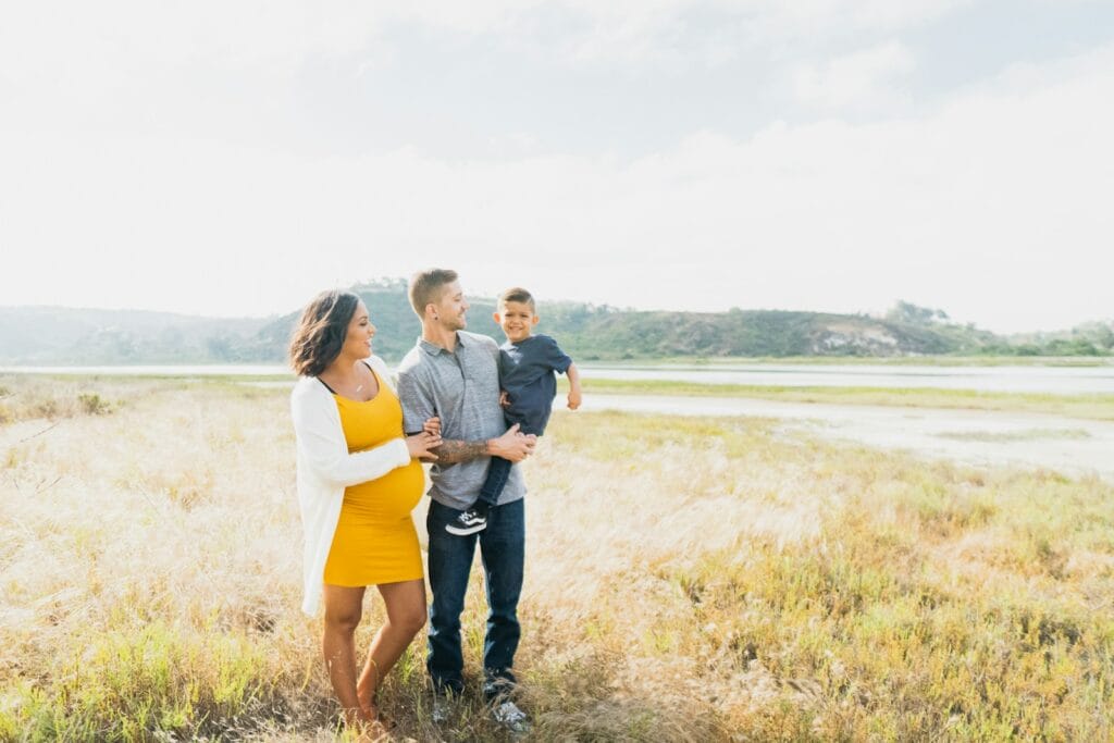 Family hugging in a field. Heavy Metal and Parasite Detox