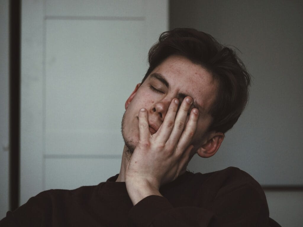 Sick man wearing black crew-neck top. Heavy Metal and Parasite Detox for toxins and parasites