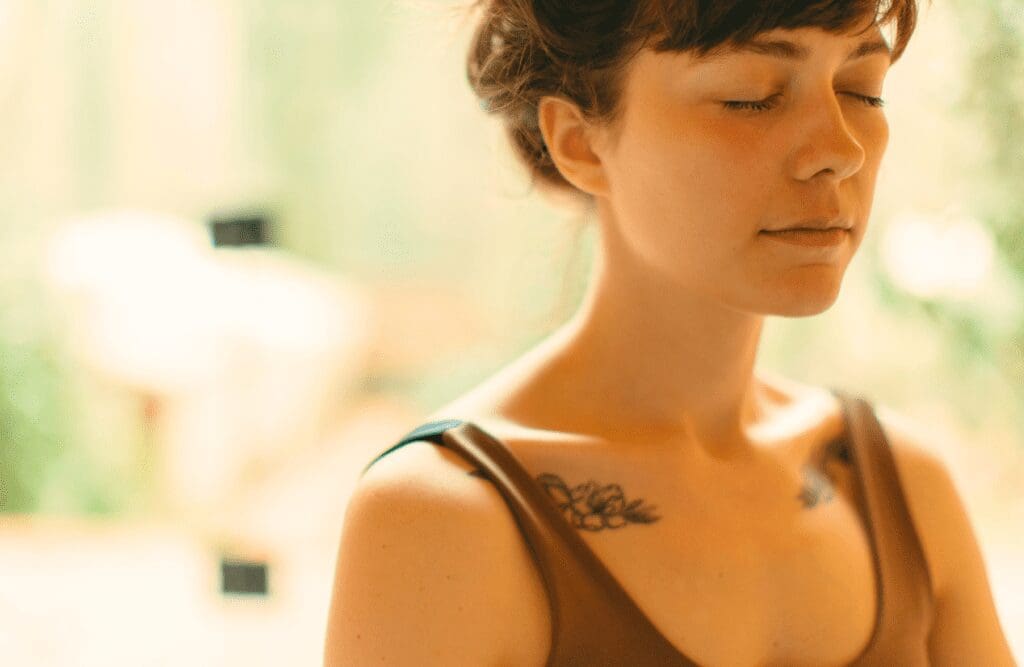 Woman during hypnotherapy with her eyes closed. Hypnosis and weight loss. Brisbane Livewell Clinic