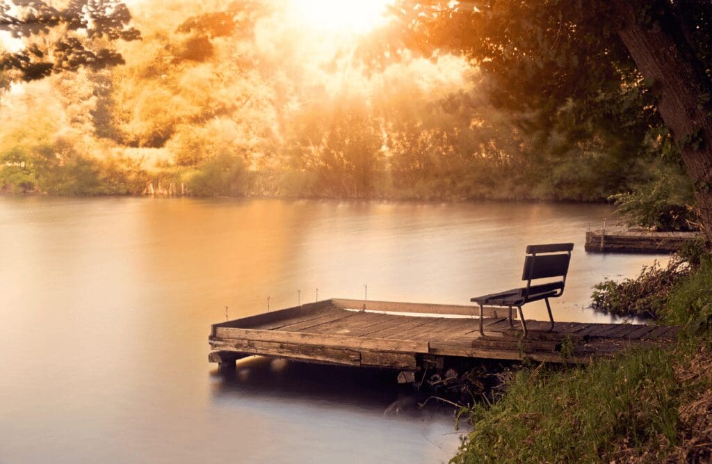 A wooden lake dock with a lone chair. Hypnosis and weight loss. Brisbane Livewell Clinic