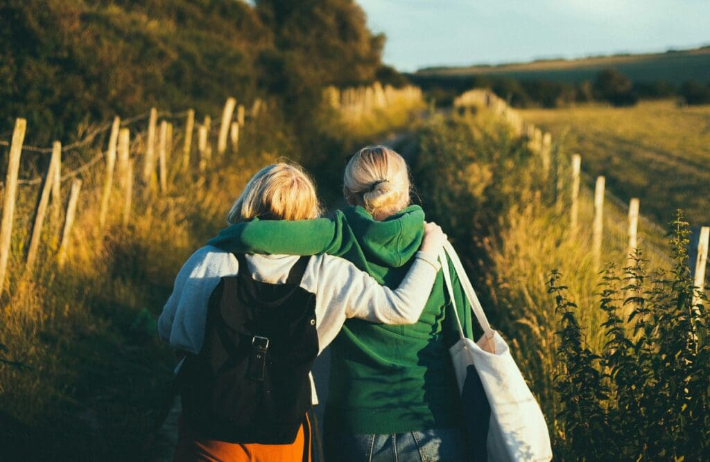 Two women walking together outdoors during daytime. Clinical Hypnotherapy Carina Heights. Brisbane Livewell Clinic