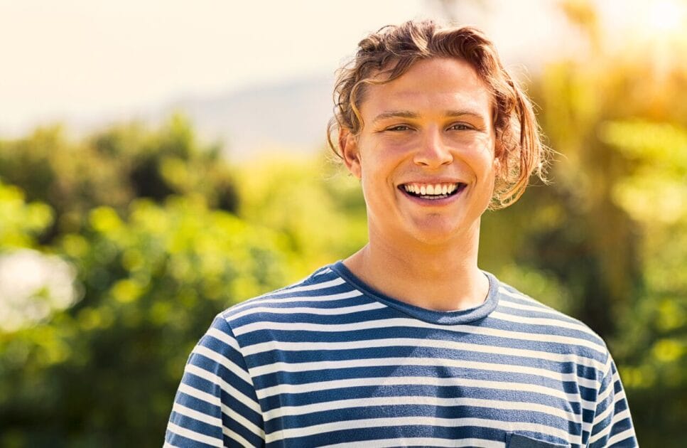 Counselling Carindale 1 Man with long blonde hair smiling at the camera. Counselling Carindale. Brisbane Livewell Clinic