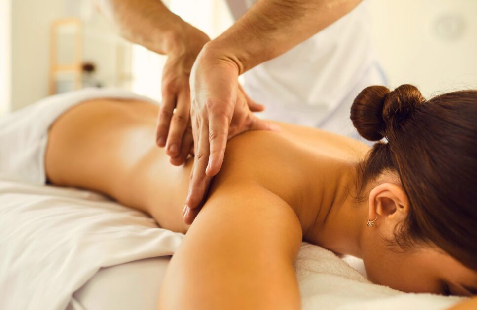 Female lying on massage table getting remedial massage. Remedial Massage Near Me. Brisbane Livewell Clinic