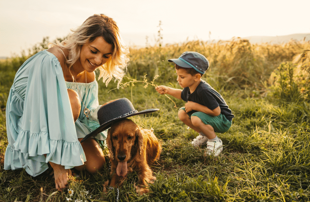 Brisbane Wellbeing 11 Mother and son playing with their dog in the field. Brisbane Wellbeing. Brisbane Livewell Clinic