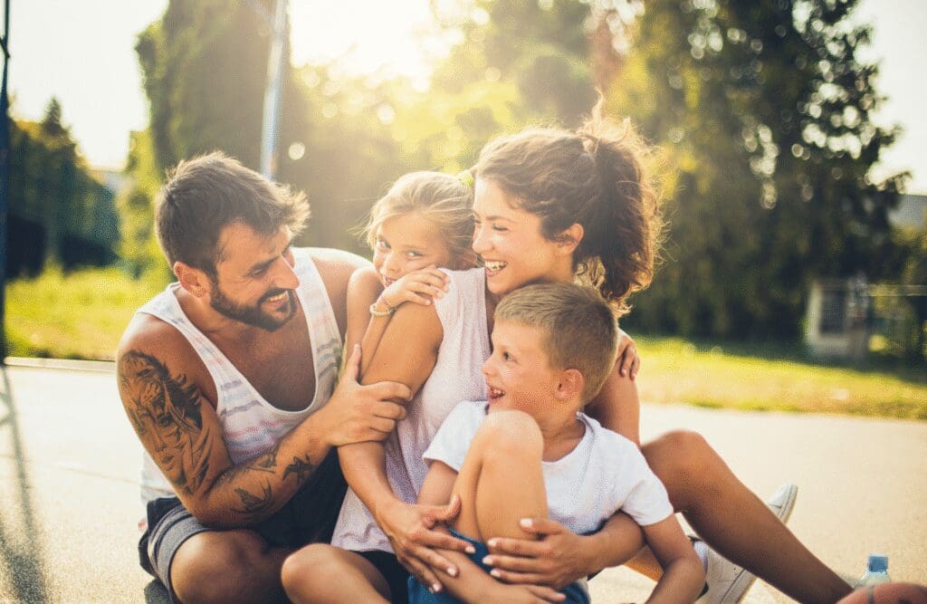 Happy family enjoying outdoors. Naturopath Brisbane. Osteopath Close to Me. Is Osteopathy covered by Private Health Insurance. Brisbane Livewell Clinic